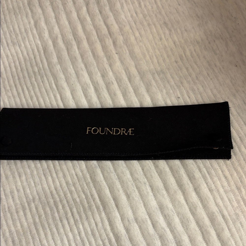 Foundrae Black felt jewelry case .